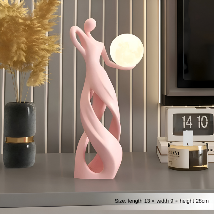 Objet décoratif lumineux moderne, figurine abstraite pour une ambiance chaleureuse et stylée.