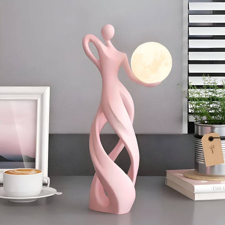 Décoration lumineuse abstraite, figurine moderne pour table ou étagère, atmosphère chaleureuse.
