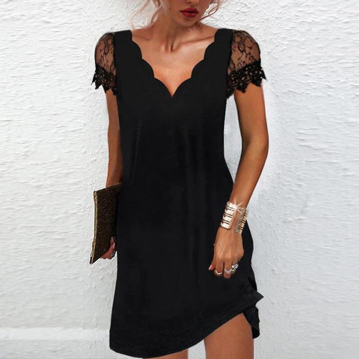 Robe midi femme élégante à col V et manches courtes. Parfaite pour cocktail, soirée ou cérémonie. Chic et tendance.