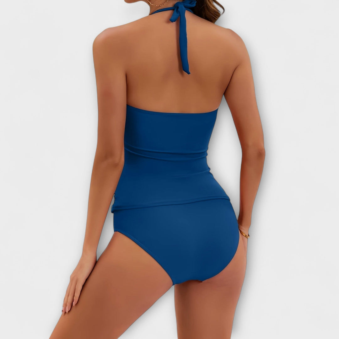 Maillot de bain une pièce femme, col V froncé, dos nu halter, détails dorés. Parfait pour l'été.