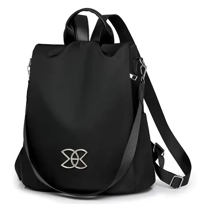 Sac à dos de sécurité discret marron avec compartiments organisateur, idéal pour le voyage et la ville.