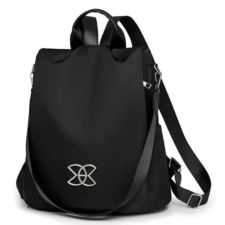 Sac à dos de sécurité discret marron avec compartiments organisateur, idéal pour le voyage et la ville.