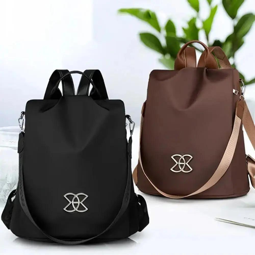 Sac à dos de voyage unisexe marron, anti-vol, design chic et fonctionnel pour la sécurité urbaine au quotidien.
