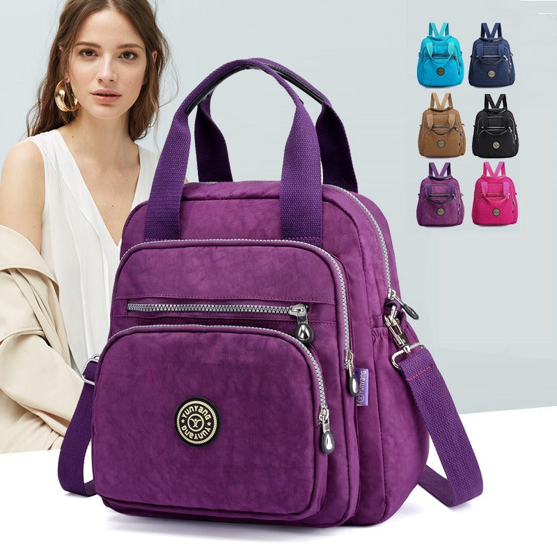 Intérieur organisé du sac à dos femme, compartiments multiples pour voyage et usage quotidien.