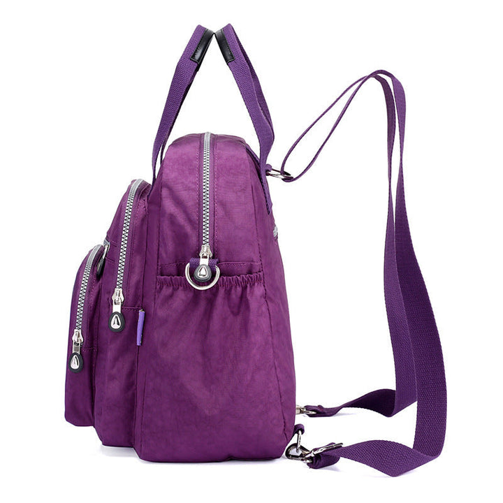 Sac à dos femme élégant, multifonction, avec poche frontale, parfait pour le travail et les loisirs.