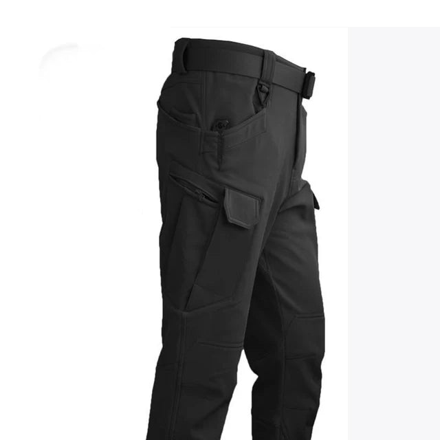 Pantalon de randonnée hivernal homme, imperméable, avec de grandes poches utilitaires pour matériel.