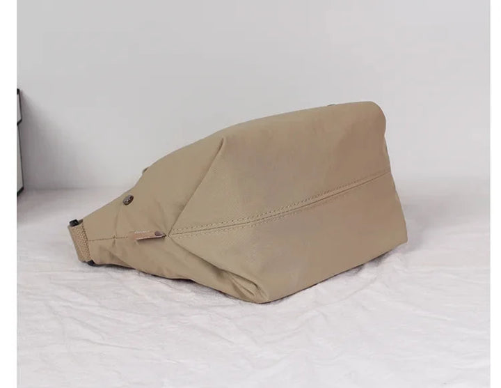 Sac banane femme multicouleur, accessoire polyvalent en toile, stylé et léger pour toutes vos tenues.
