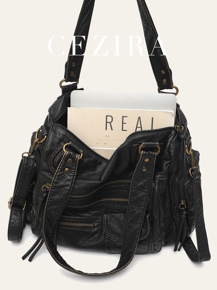 Sac cabas femme vintage avec bandoulière ajustable. Un accessoire mode et pratique en similicuir brun.