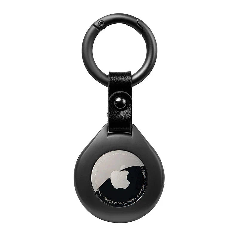 Porte-AirTag haut de gamme en cuir noir, détails en métal, accessoire durable.