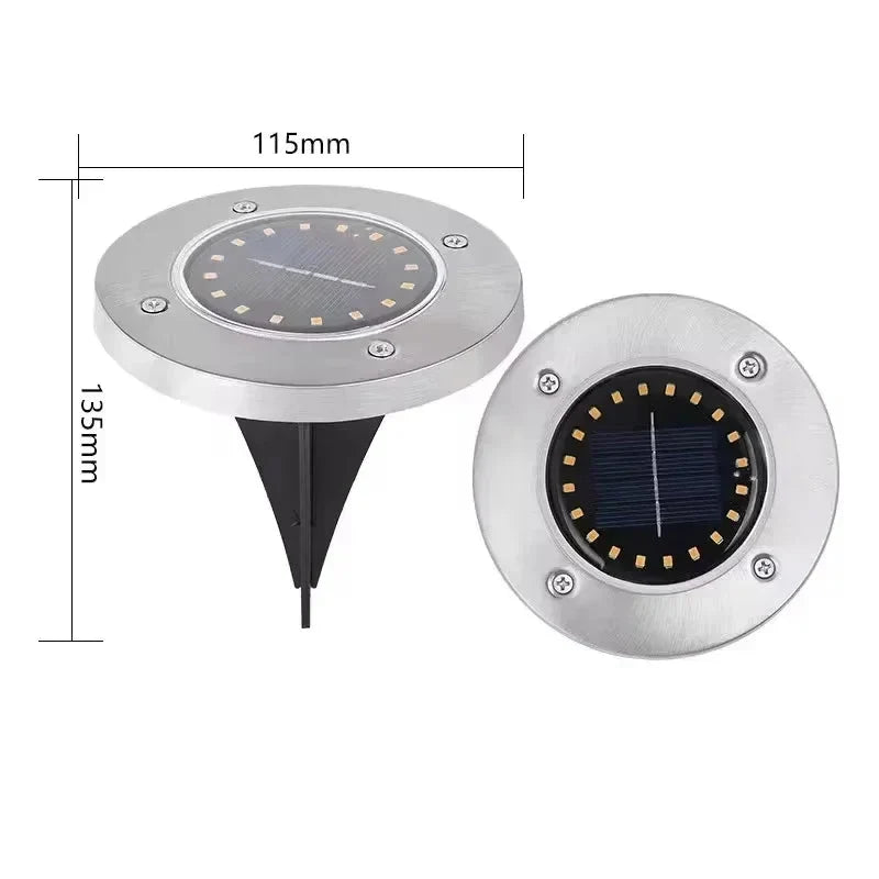 Éclairage solaire de jardin LED en acier inoxydable, encastrable, rond et étanche, pour un chemin ou une terrasse extérieure.