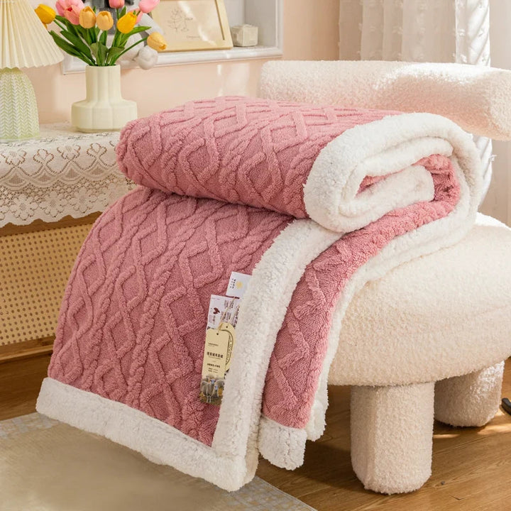 Couverture polaire sherpa ultra douce et chaude pour un confort hivernal maximal sur le canapé ou au lit.