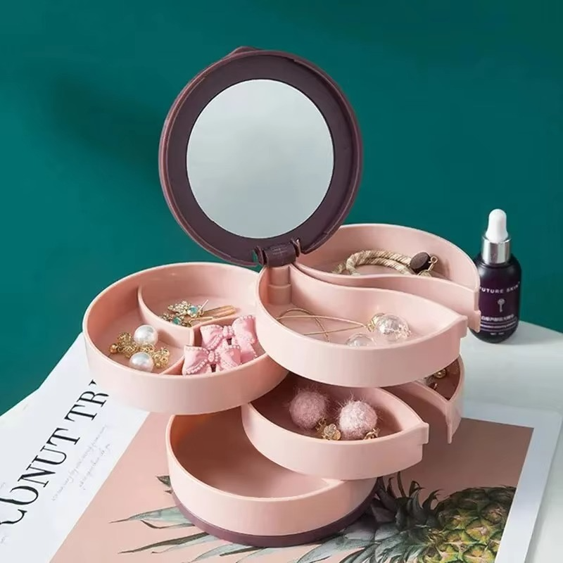 Présentoir bijoux rotatif en ABS, élégant et compact, idéal pour organiser les accessoires femme sur une coiffeuse.