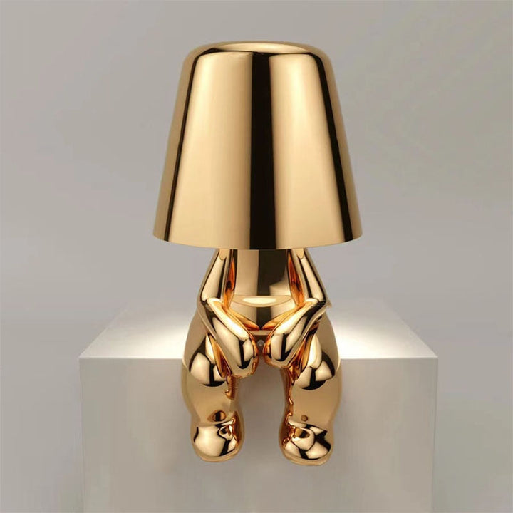 Lampe de table LED à lueur douce, design homme stylisé, lumière d'ambiance moderne pour salon et chambre.