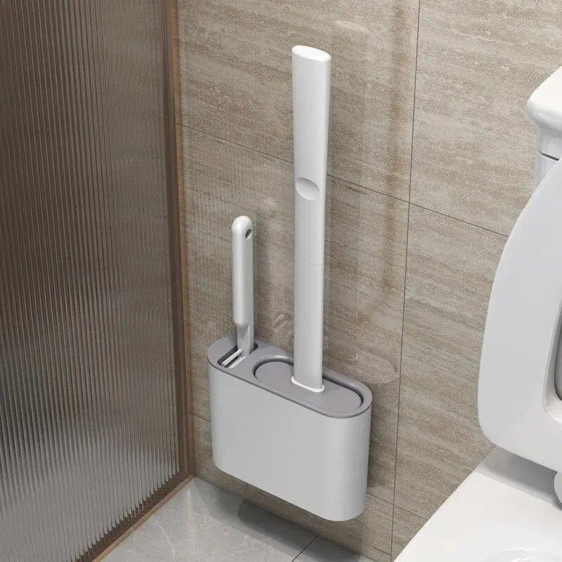 Brosse WC DuoClean 2-en-1 en silicone avec support mural pour un nettoyage hygiénique et compact de votre salle de bain.