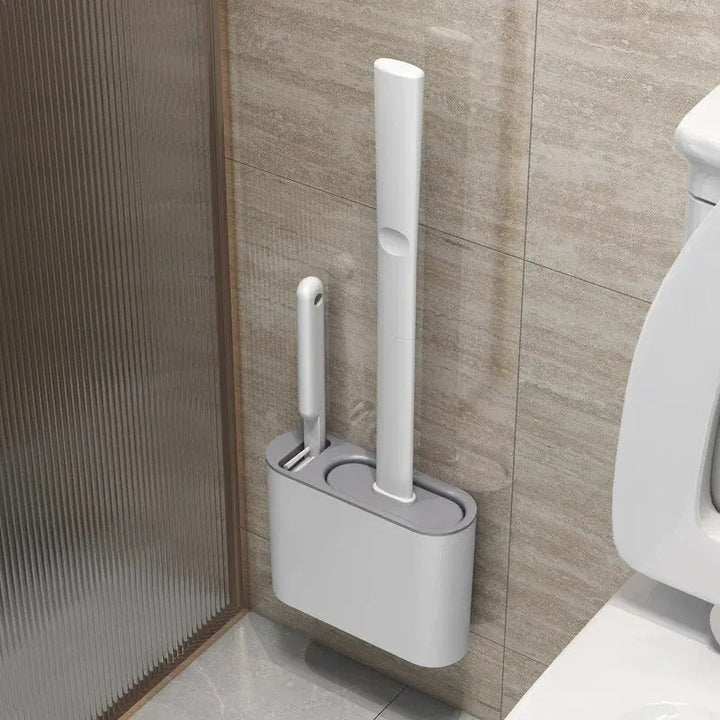Brosse WC DuoClean 2-en-1 en silicone avec support mural pour un nettoyage hygiénique et compact de votre salle de bain.