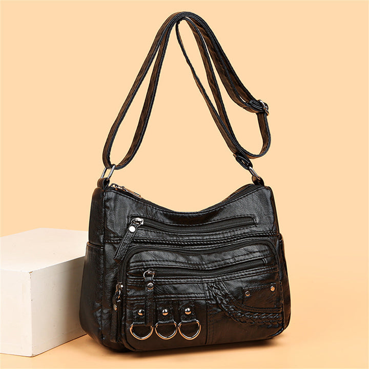 Sac à main marron vintage sophistiqué, idéal pour femme, accessoire de mode féminine.
