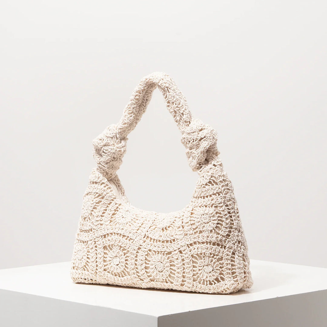 Sac d'été en crochet artisanal ivoire, style bohème chic, un accessoire élégant pour femme.