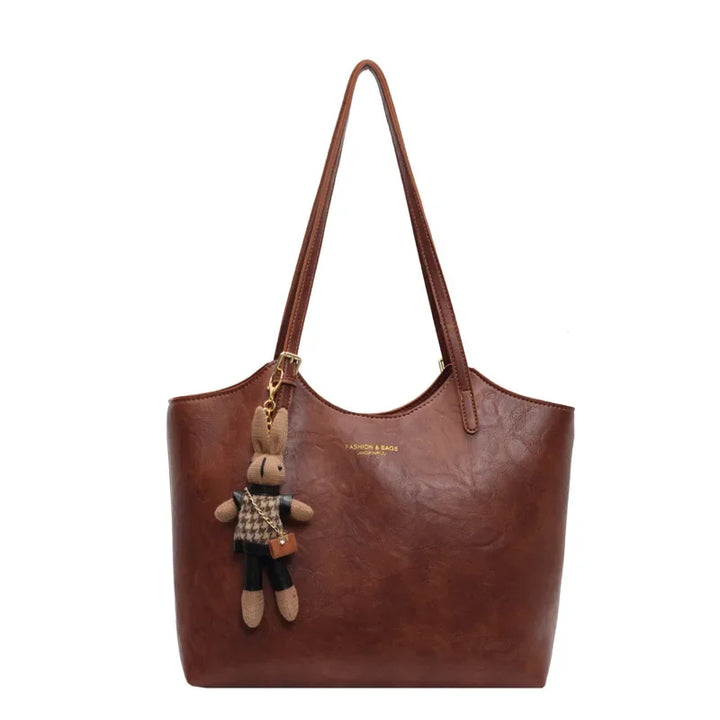 Sac à main noir pour femme en cuir végan, fourre-tout rétro. Accessoire vintage chic.