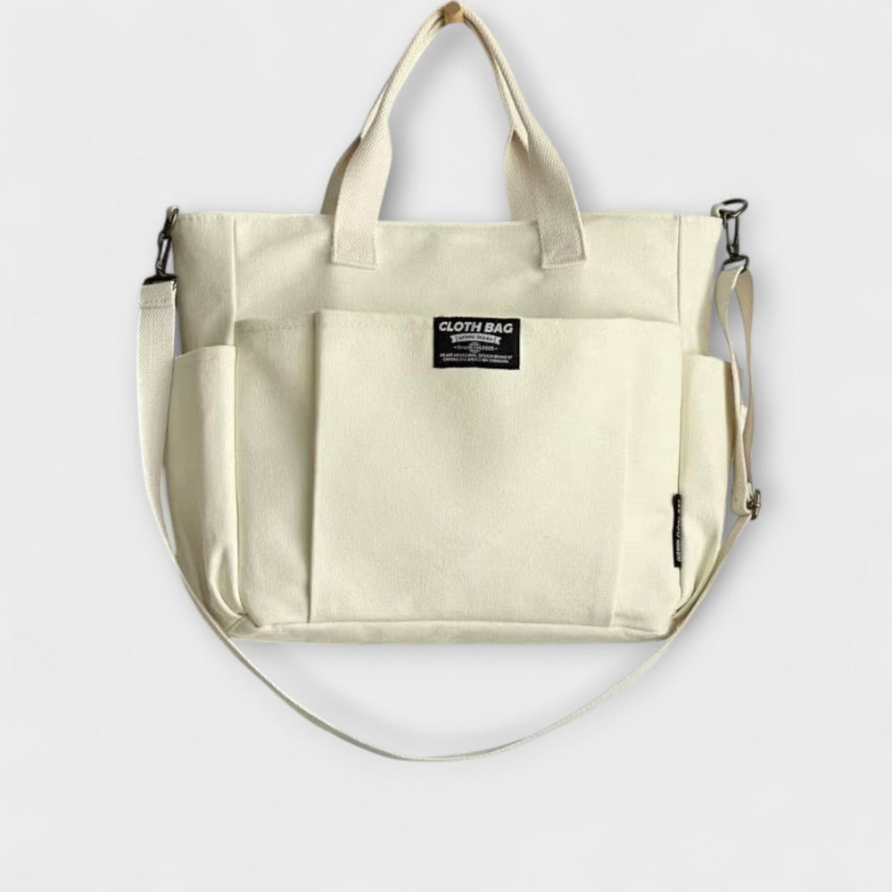 Sac fourre-tout femme en toile kaki, idéal pour transporter un ordinateur ou pour le shopping.