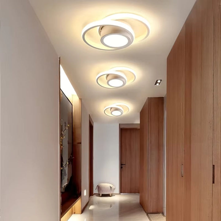 Plafonnier LED élégant, double anneau fin, éclairage d'intérieur contemporain et lumineux.