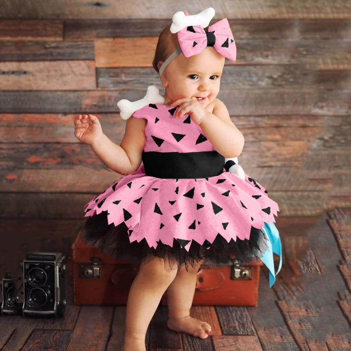 Adorable déguisement Pierrafeu bébé fille. Robe verte/orange, os déco. Parfait pour première fête costumée enfant.