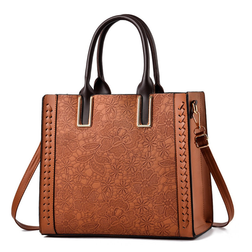 Sac à main noir en cuir véritable élégant avec bandoulière, accessoire de mode femme.