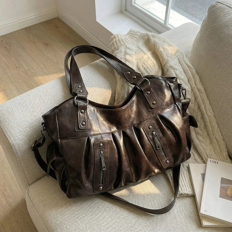 Sac de cours Kéa élégant pour femme en similicuir, idéal pour l'organisation quotidienne.