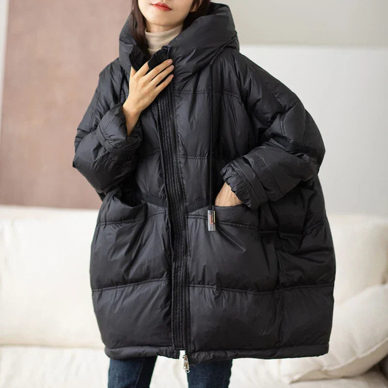 Veste d'hiver femme oversize décontractée, offrant chaleur et confort. Vêtement femme moderne et tendance.