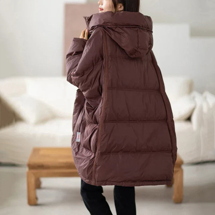 Manteau oversize femme, doudoune chaude et confortable. Idéale pour un look hivernal décontracté ou élégant.