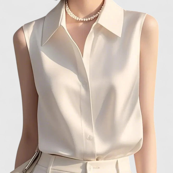 Chemisier femme chic et raffiné sans manches, style moderne pour look décontracté ou habillé en été.