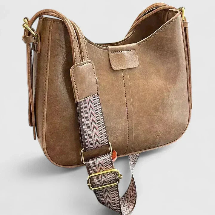 Sac à main élégant pour femme avec bandoulière ajustable, un accessoire mode indispensable et pratique.