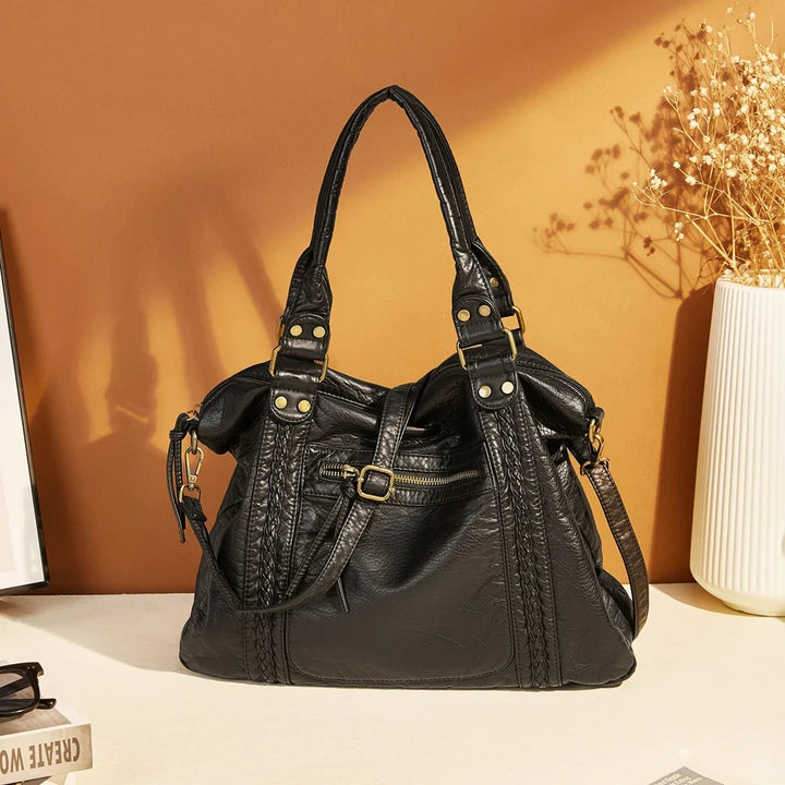 Sac femme vintage synthétique avec bandoulière, parfait pour les cours, très spacieux et organisé.