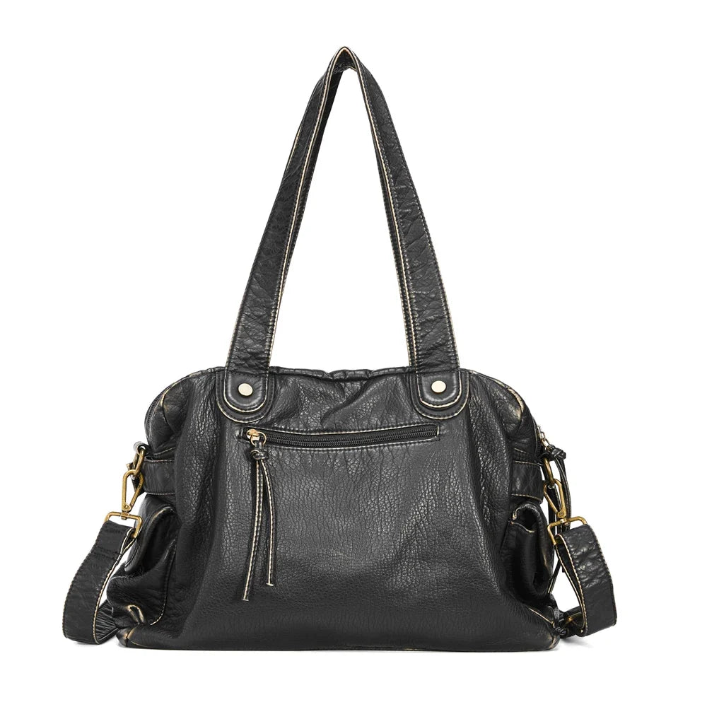 Sac en cuir synthétique noir pour cours, porté épaule ou croisé. Style rétro et élégant.