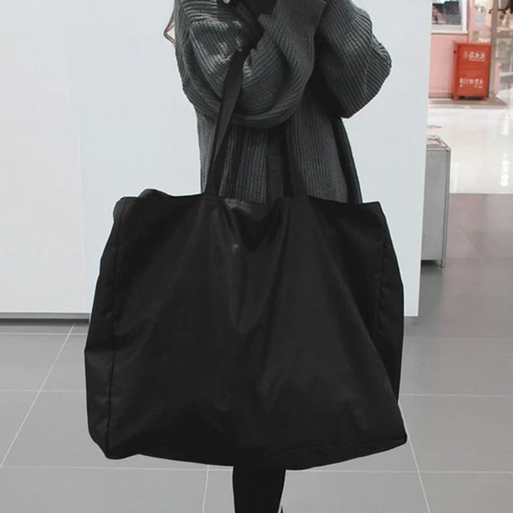 Sac de voyage pour femmes, imperméable, léger et pliable, offrant grande capacité pour tous vos essentiels de voyage.
