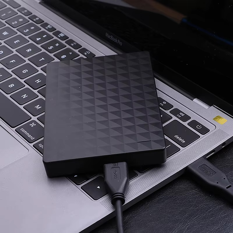 Disque dur externe USB 3.0 compact de 2 To. Appareil de stockage portable pour sauvegarder vos fichiers rapidement.