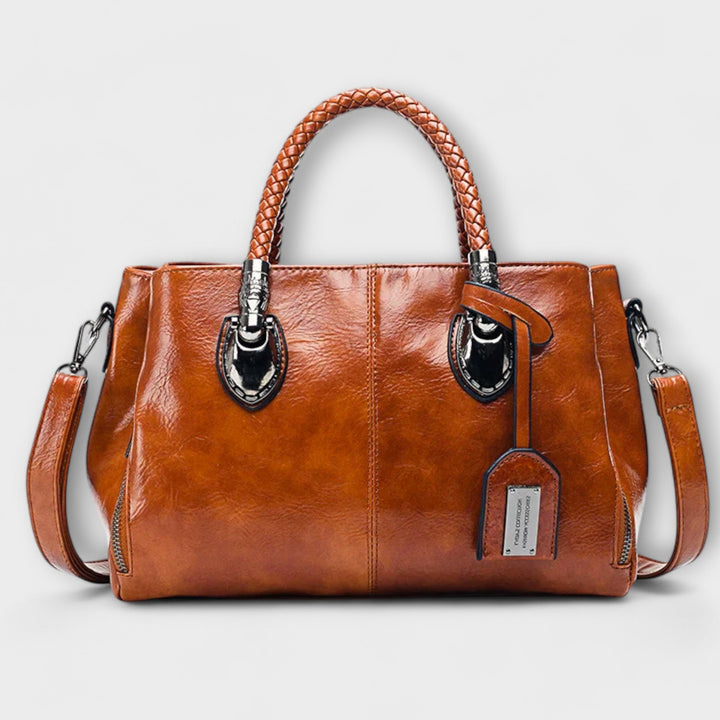Sac polochon élégant et spacieux pour femme, parfait pour le voyage ou les affaires. Design moderne et chic.