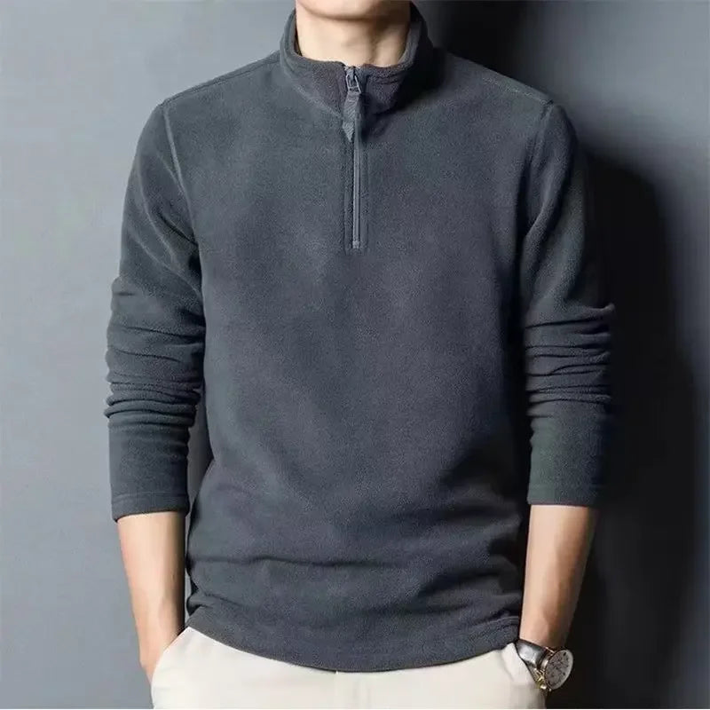 Pull polaire demi-zip homme, confortable et léger, idéal pour l'hiver et l'automne. Chaleur garantie.