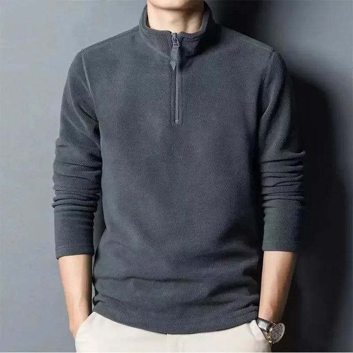 Pull polaire demi-zip homme, confortable et léger, idéal pour l'hiver et l'automne. Chaleur garantie.
