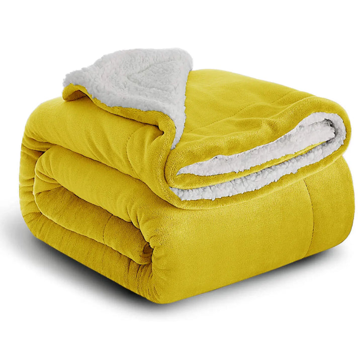 Plaid confort sherpa réversible, couverture douce et chaude pour toutes les saisons à la maison.