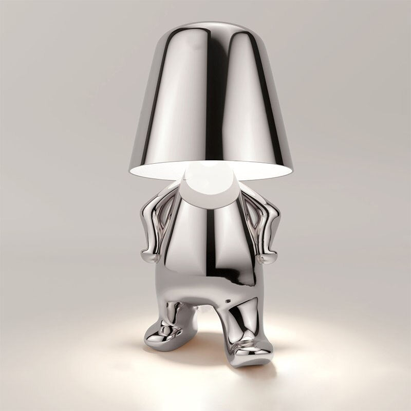 Lampe de table design architectural, LED ornement homme stylisé, lumière d'ambiance moderne pour intérieur.