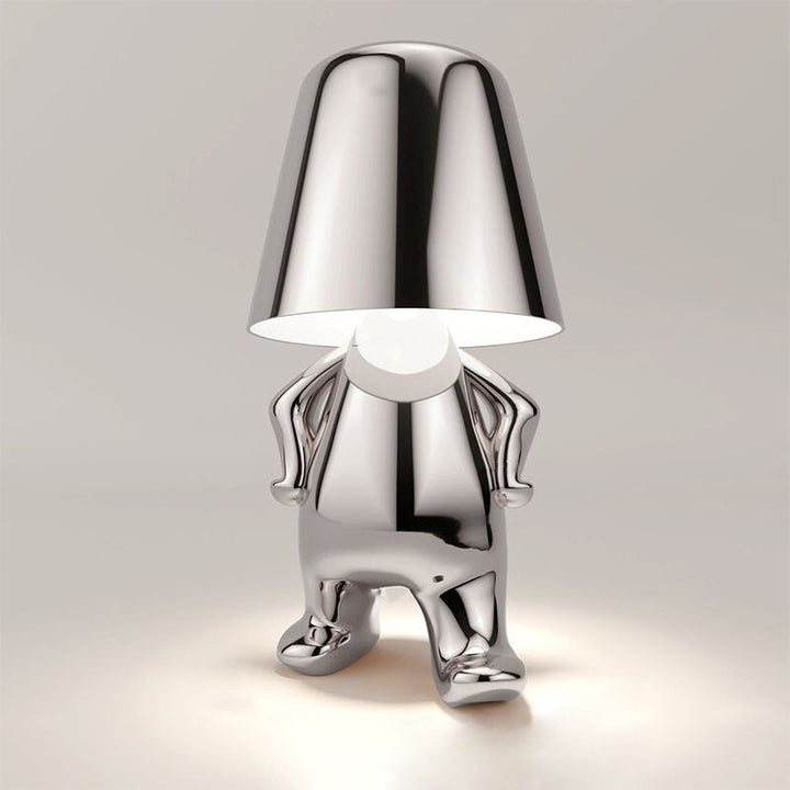 Lampe de table design architectural, LED ornement homme stylisé, lumière d'ambiance moderne pour intérieur.