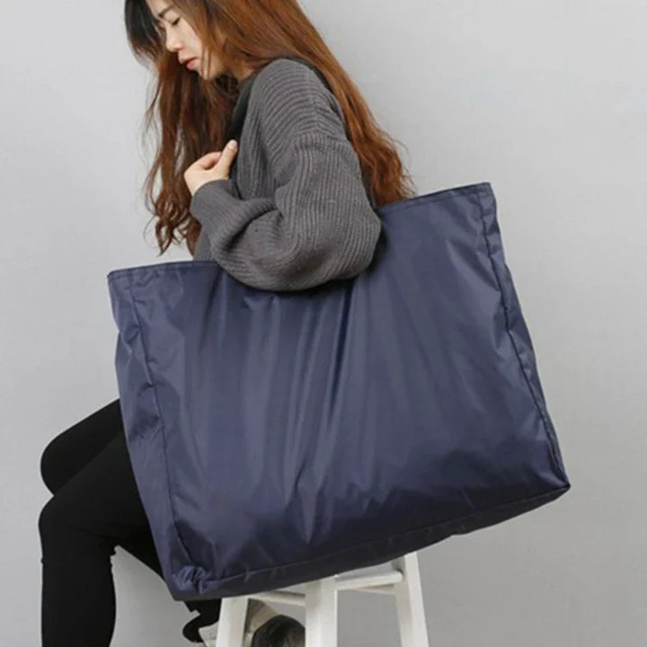 Sac pliable de voyage pour femmes, imperméable en nylon, grande capacité, léger, idéal pour bagage d'appoint ou sport.