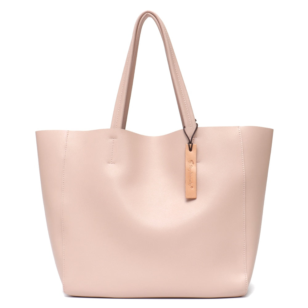 Sac à main femme en cuir, style cabas, avec poignées robustes et finition soignée.