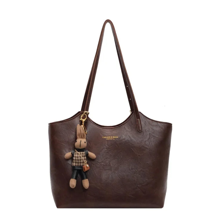 Sac fourre-tout rouge en cuir végan, look vintage. Sac à main femme élégant et rétro.