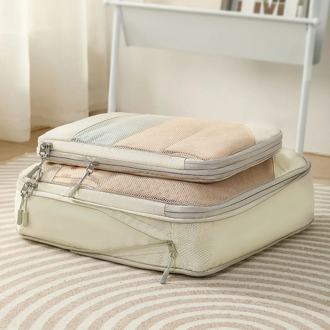 Organisateur de compression pour valise, réduit le volume des vêtements, optimisation du rangement pour voyage.