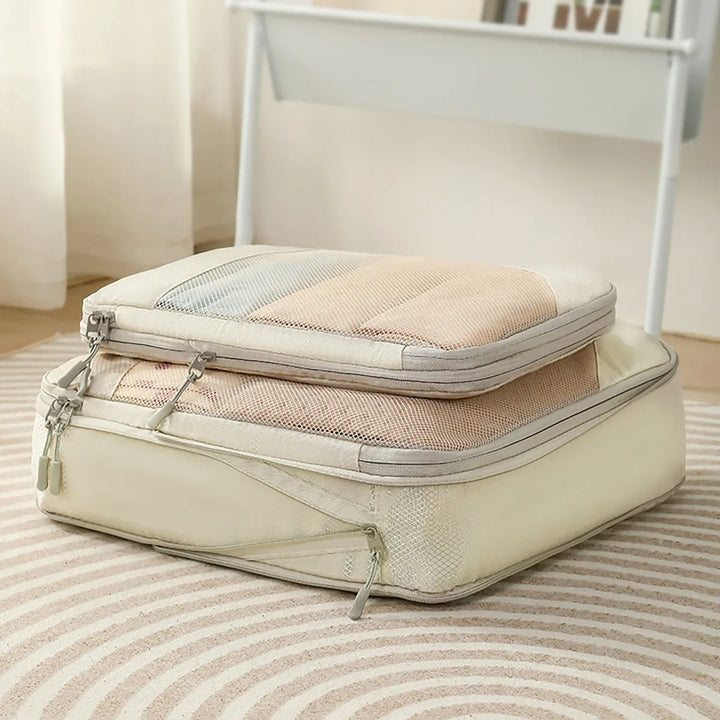 Organisateur de compression pour valise, réduit le volume des vêtements, optimisation du rangement pour voyage.