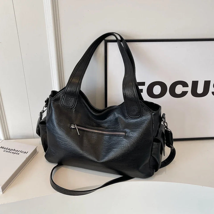 Sac cabas élégant Magda posé, montrant sa structure et ses poignées robustes et pratiques.