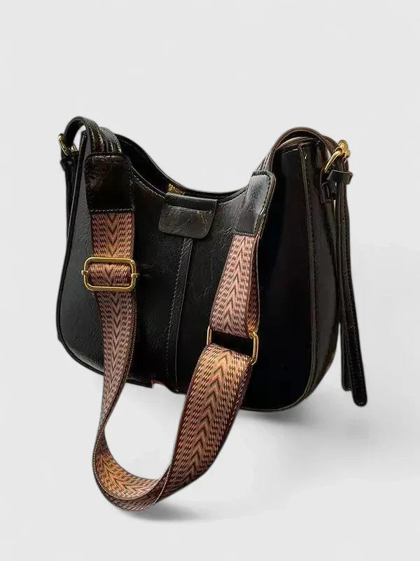 Sac élégant femme, accessoire mode sophistiqué avec bandoulière, parfait pour compléter votre look.