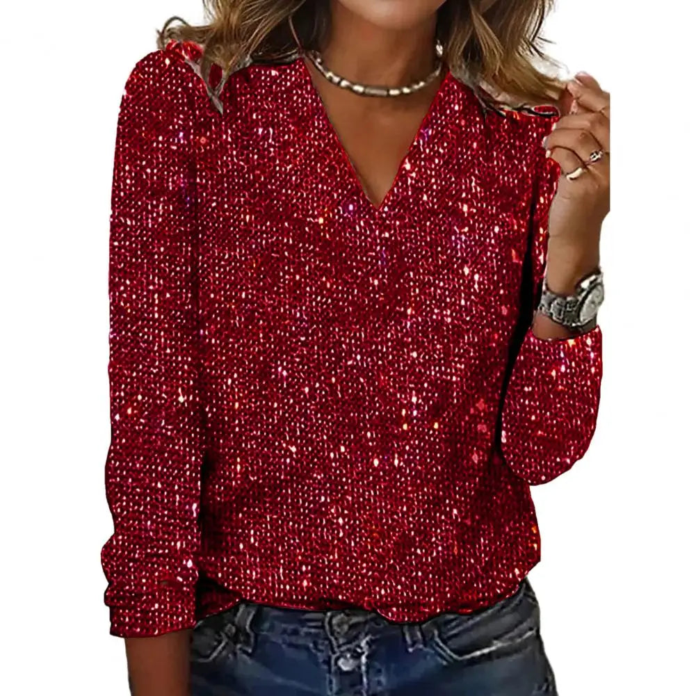 Blouse femme chic à paillettes scintillantes et col V. Manches longues élégantes, parfaite pour un événement.