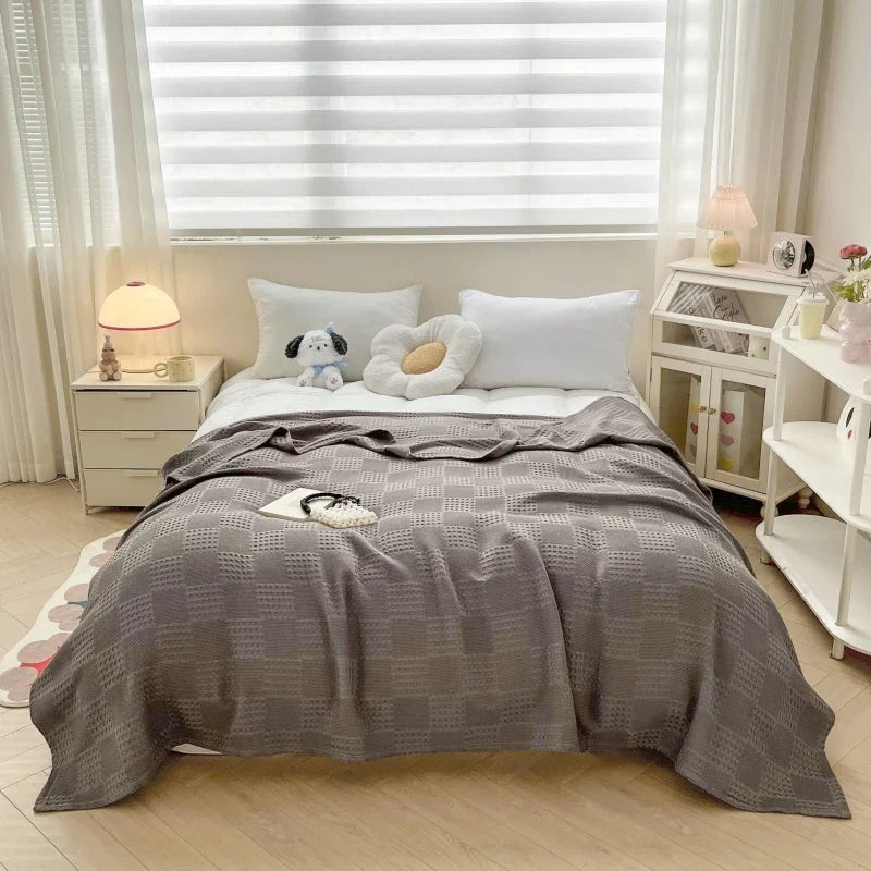Plaid d'été en coton doux, idéal pour la maison, les voyages et une touche de décoration estivale.